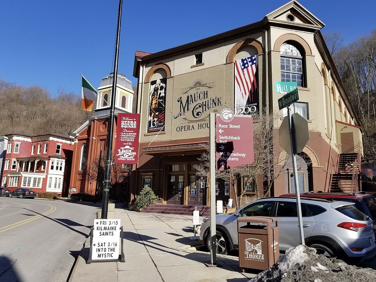 The brick facade and painted sign of the Mauch Chunk Opera House on a downtown corner.